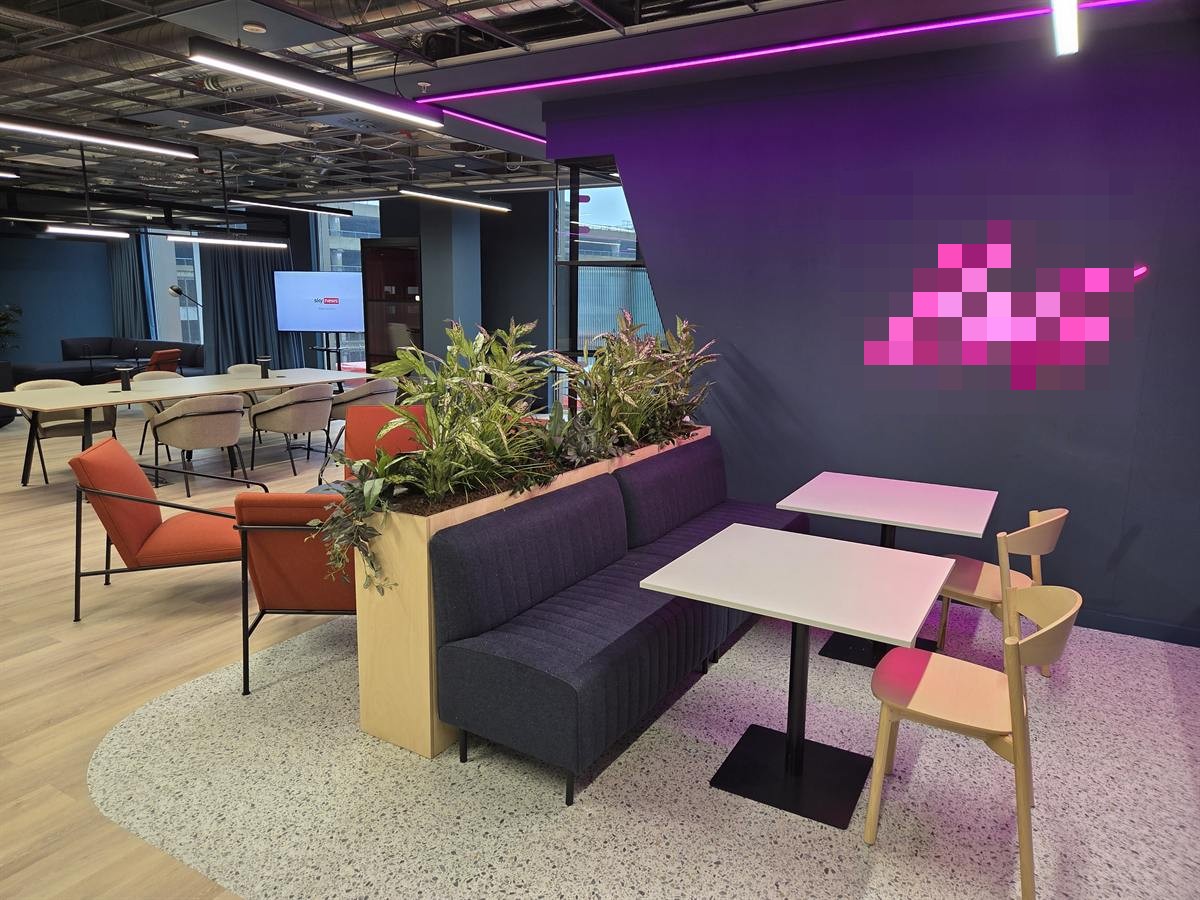 Breakout Area - Office Fit-Out MediaCityUK Salford Branded breakout and cafe area with neon signage, banquette seating and planting, office fit-out MediaCityUK Salford by JDCM Ltd